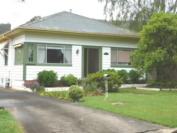Earlier front view of the weatherboard house
